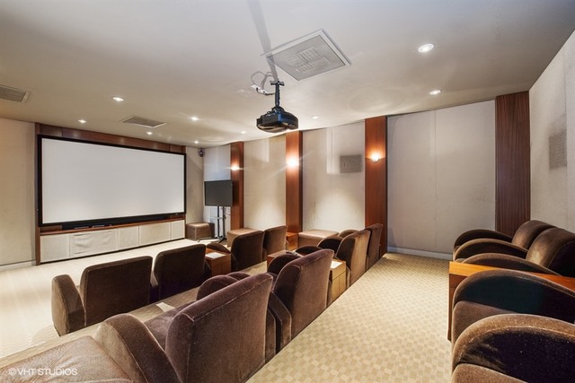 655 West Irving Park Road, Unit 4103 Chicago, IL 60613 - Photo 22 of 25 a room with furniture projector and screen