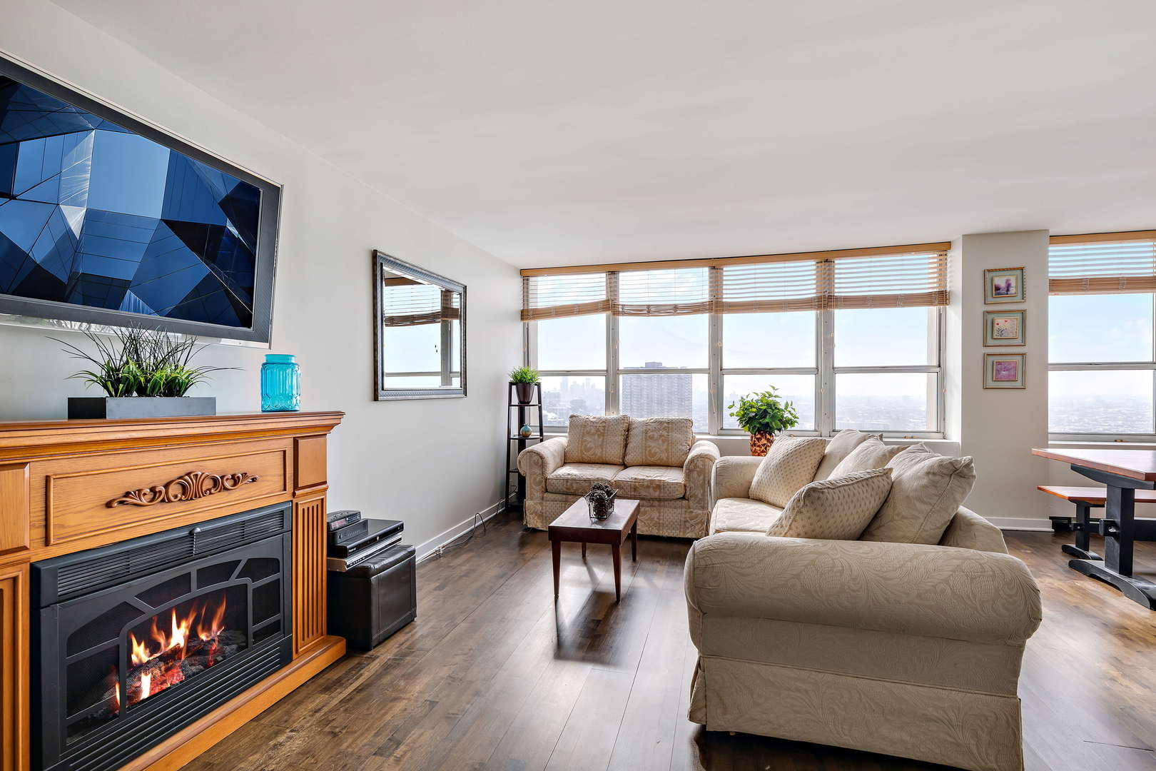 655 West Irving Park Road, Unit 4103 Chicago, IL 60613 - Photo 4 of 25 a living room with furniture and a fireplace