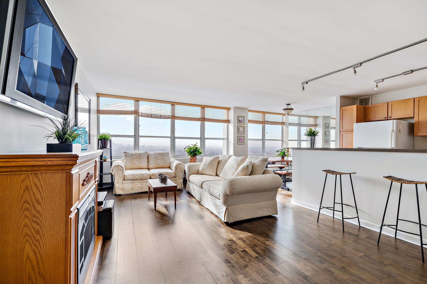 655 West Irving Park Road, Unit 4103 Chicago, IL 60613 - Photo 5 of 25 a living room with furniture and a large window