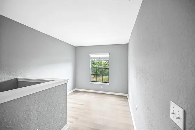 a view of an empty room and window