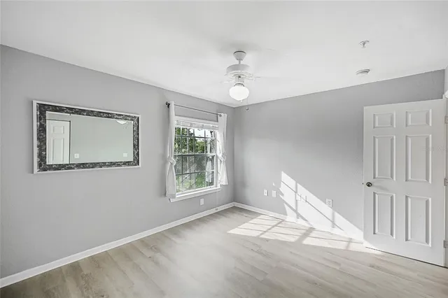 a view of an empty room with a window