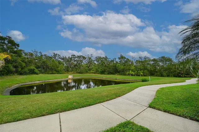 a view of a lake with a big yard