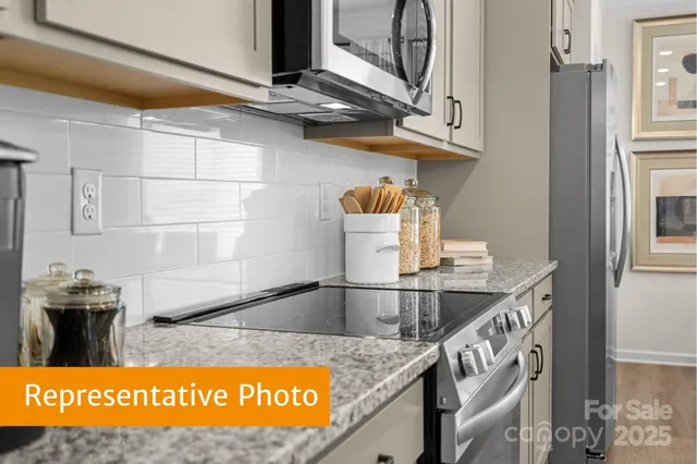 a view of kitchen cabinet and microwave