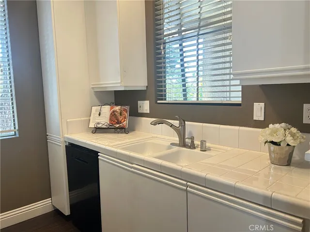 a kitchen with a sink and window