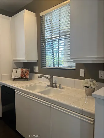 a bathroom with a sink and a window