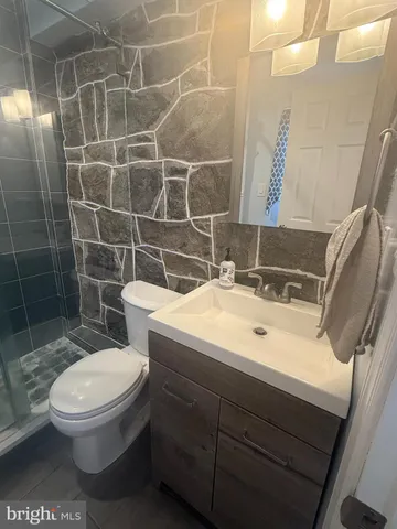 a view of a porch with wooden floor and chair
