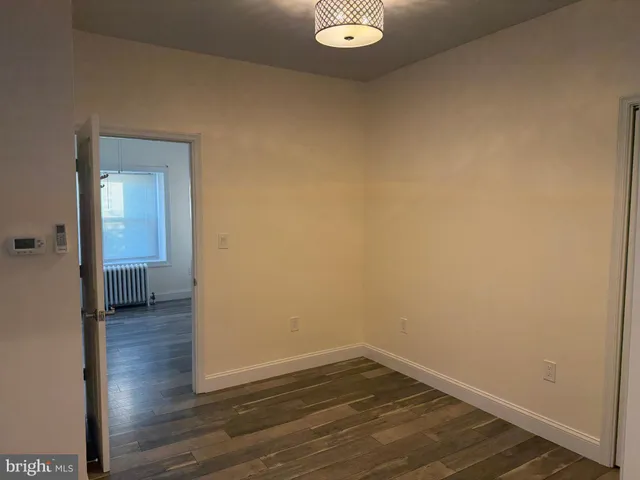 a view of a small space with wooden floor