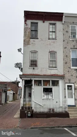 a front view of a house with yard