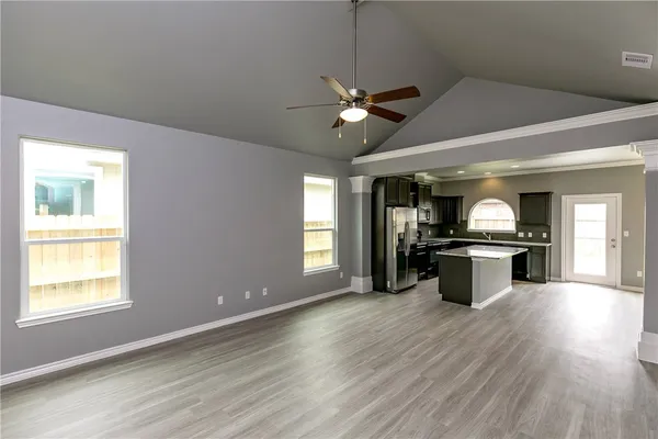 a view of kitchen with sink microwave and stove