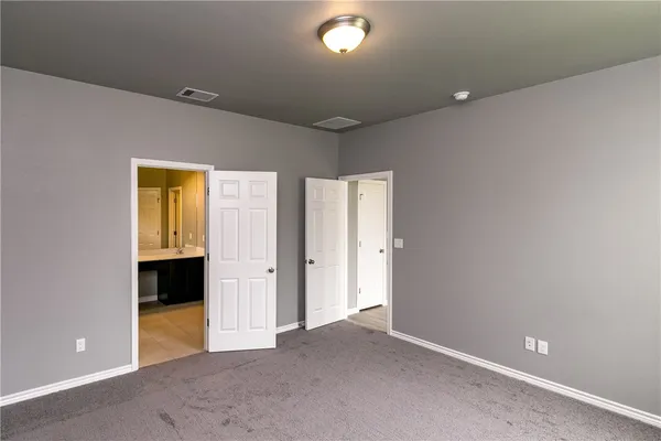 an empty room with large window