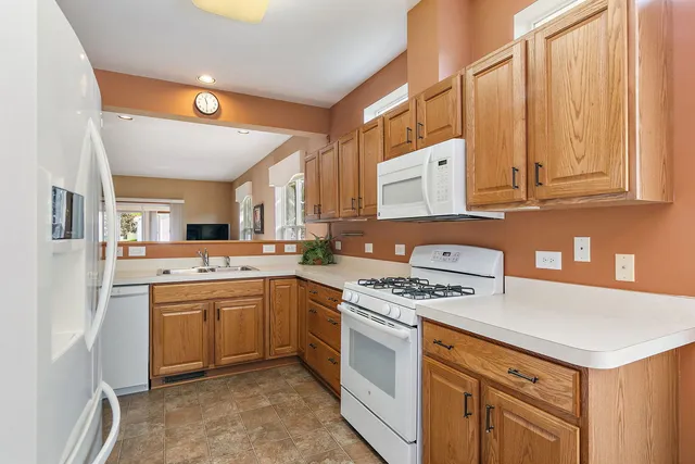 a kitchen with stainless steel appliances granite countertop a stove and a sink
