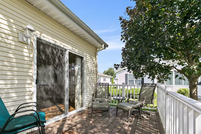 a view of a balcony with chairs