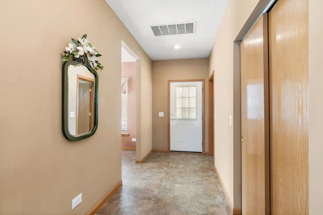 a view of a bathroom with sink and mirror