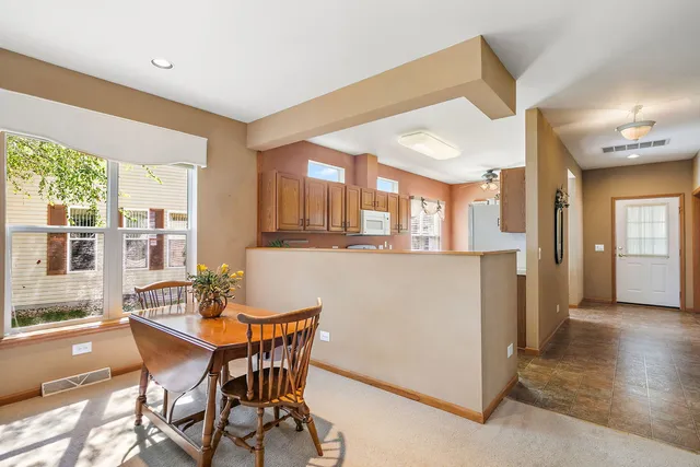 a dining room with furniture and window