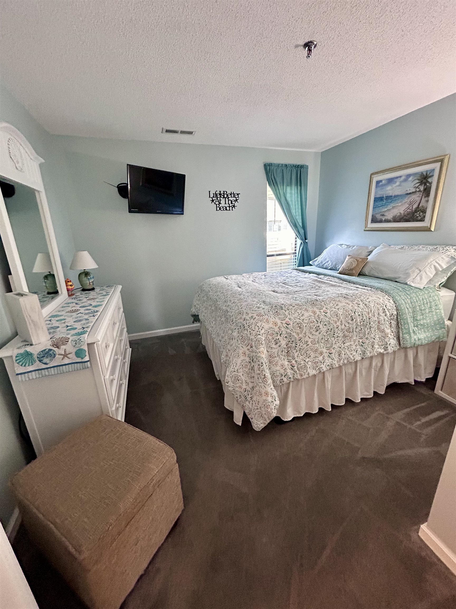 1101 Possum Trot Road, Unit B302 North Myrtle Beach, SC 29582 - Photo 16 of 22 Bedroom with a textured ceiling and dark carpet