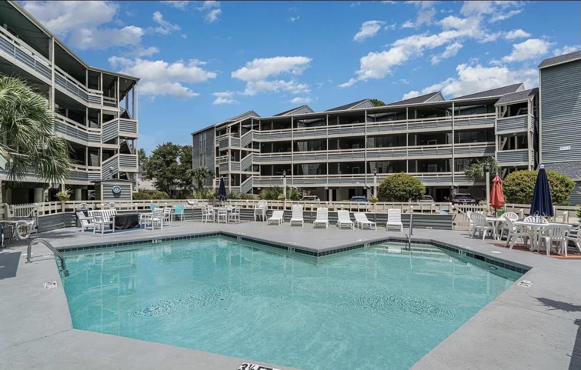 1101 Possum Trot Road, Unit B302 North Myrtle Beach, SC 29582 - Photo 4 of 22 View of pool featuring a patio area