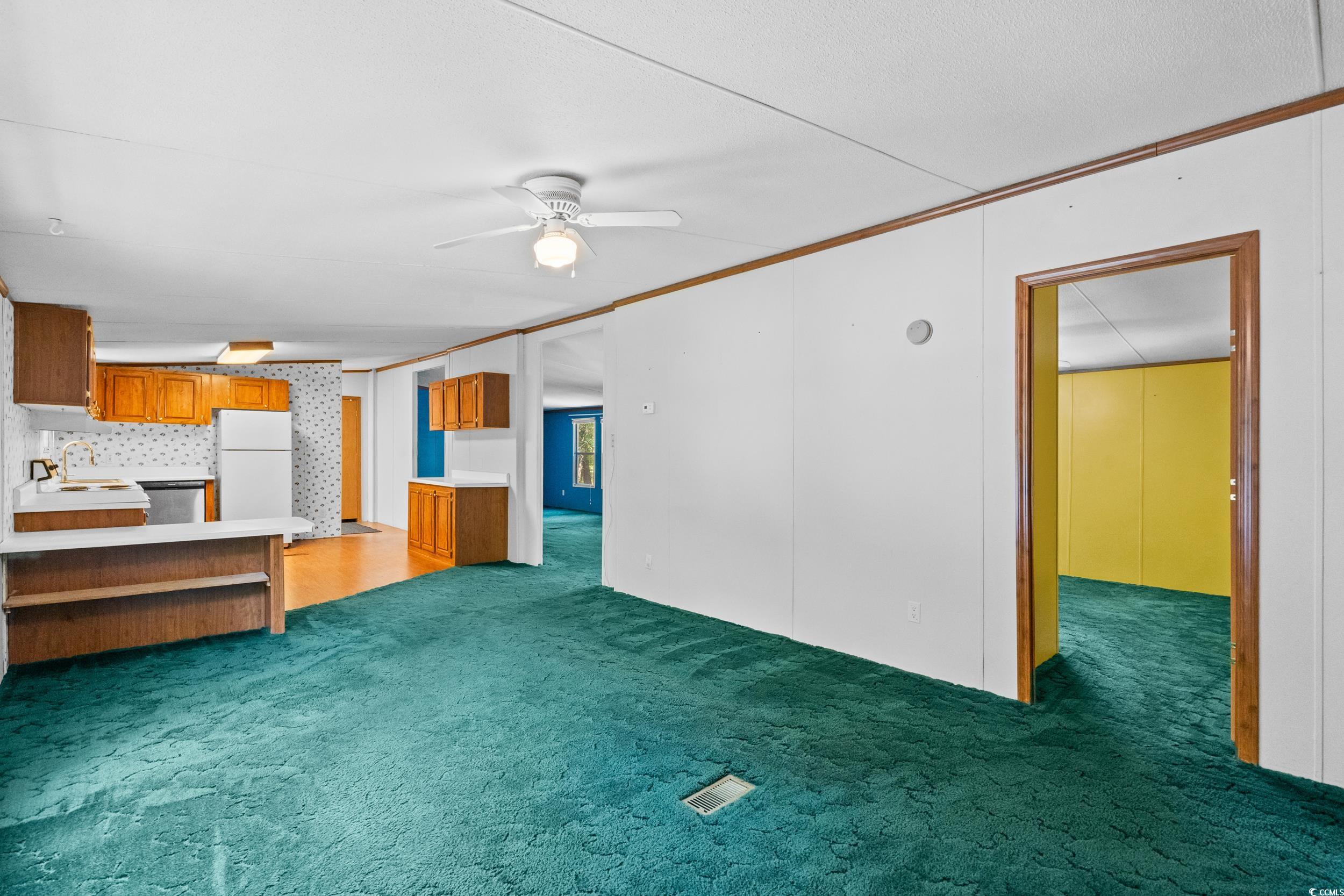 1731 Mineral Springs Road Conway, SC 29527 - Photo 17 of 38 Unfurnished living room with crown molding, sink,