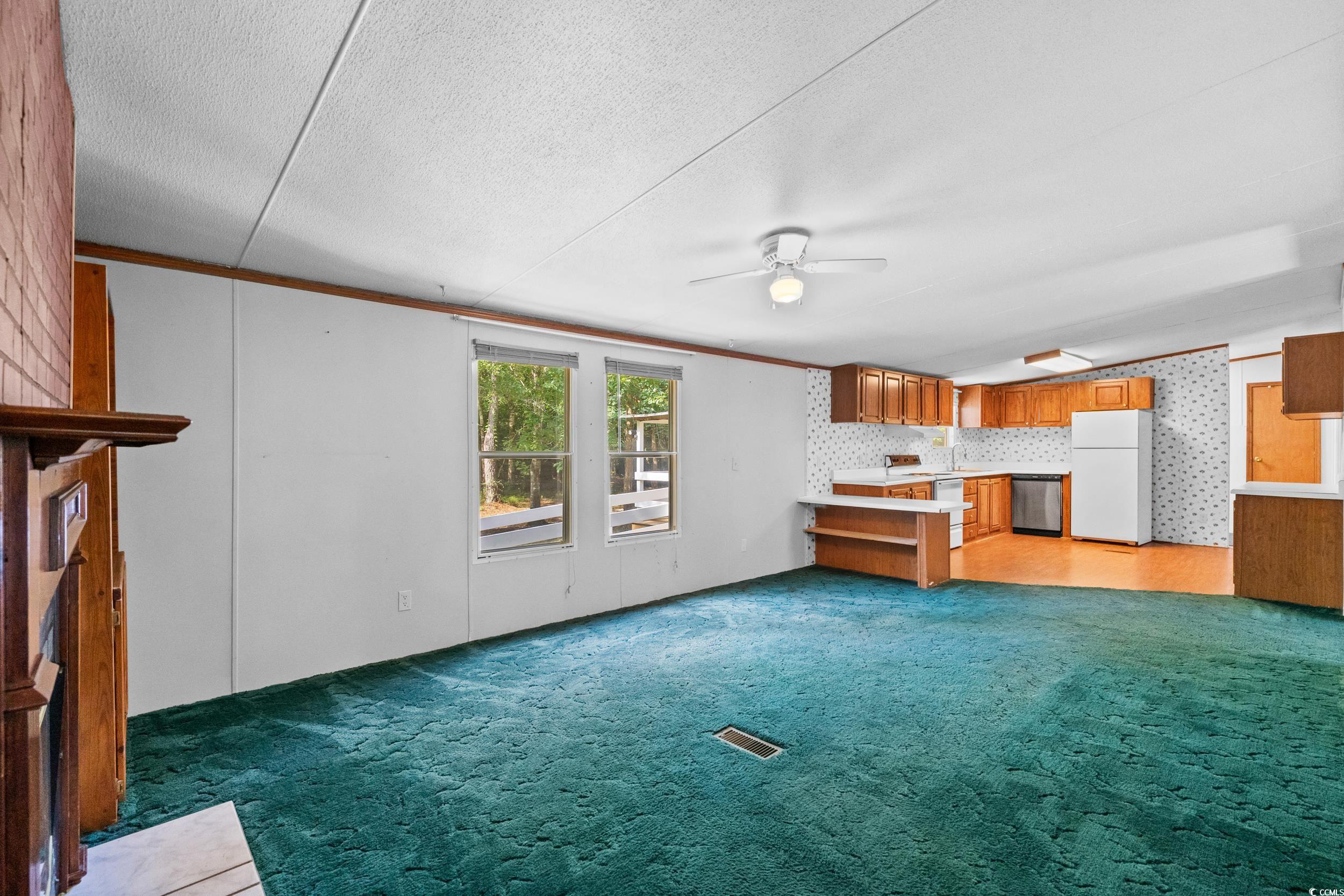 1731 Mineral Springs Road Conway, SC 29527 - Photo 18 of 38 Unfurnished living room with carpet, a textured ce