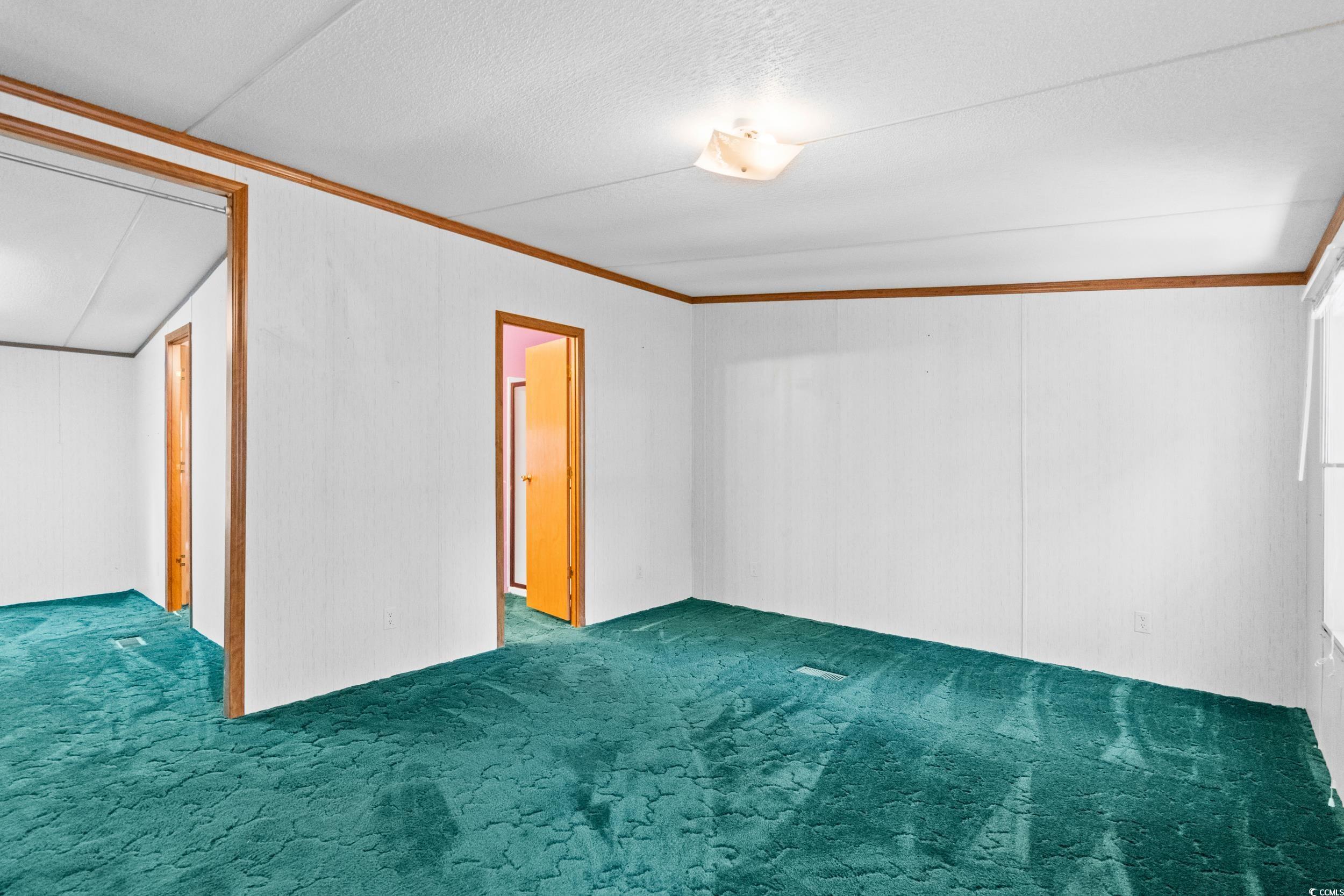 1731 Mineral Springs Road Conway, SC 29527 - Photo 23 of 38 Unfurnished room with carpet flooring, crown moldi