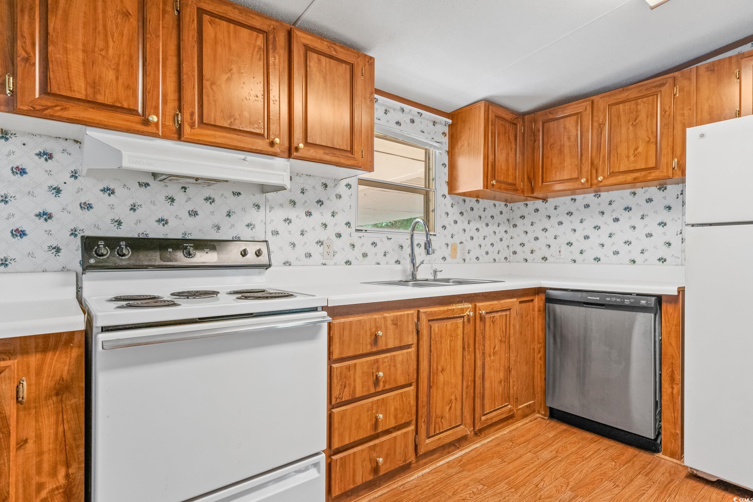 1731 Mineral Springs Road Conway, SC 29527 - Photo 38 of 38 Kitchen with sink, white appliances, and light har