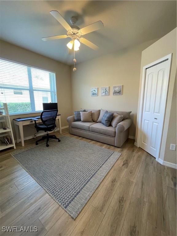 21326 Bella Terra Boulevard Estero, FL 33928 - Photo 16 of 47 a living room with furniture and a large window