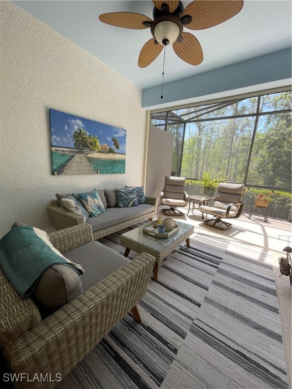21326 Bella Terra Boulevard Estero, FL 33928 - Photo 35 of 47 a living room with furniture and a large window