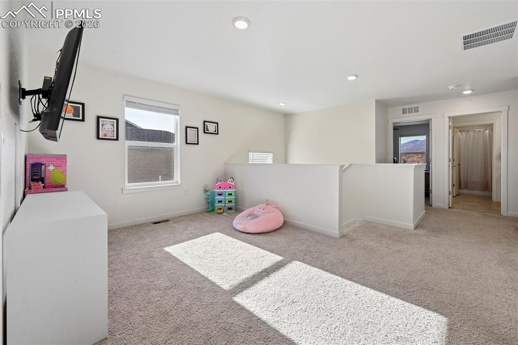 15945 Little Bluestem Road Monument, CO 80132 - Photo 16 of 49 a room with furniture and a window