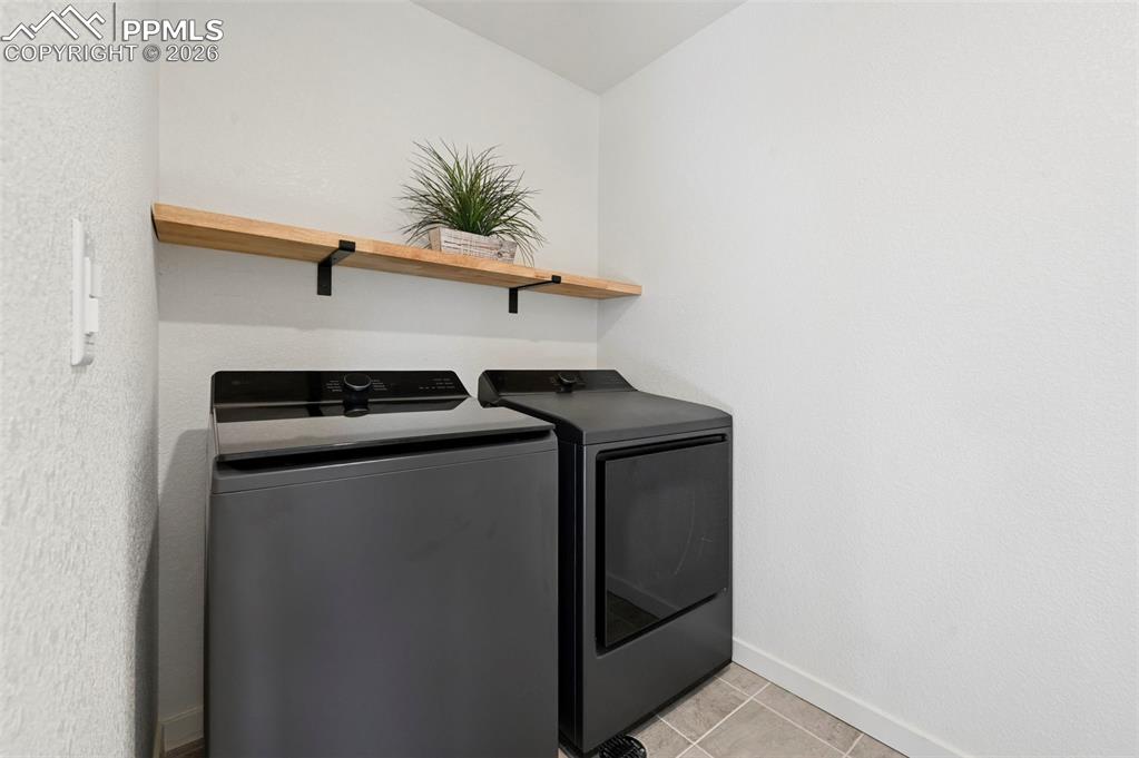 15945 Little Bluestem Road Monument, CO 80132 - Photo 20 of 49 a utility room with dryer and washer