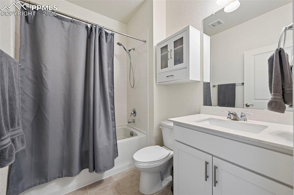 15945 Little Bluestem Road Monument, CO 80132 - Photo 23 of 49 a bathroom with a sink toilet and shower
