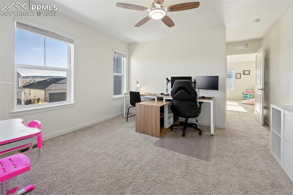 15945 Little Bluestem Road Monument, CO 80132 - Photo 24 of 49 a work room with furniture and windows