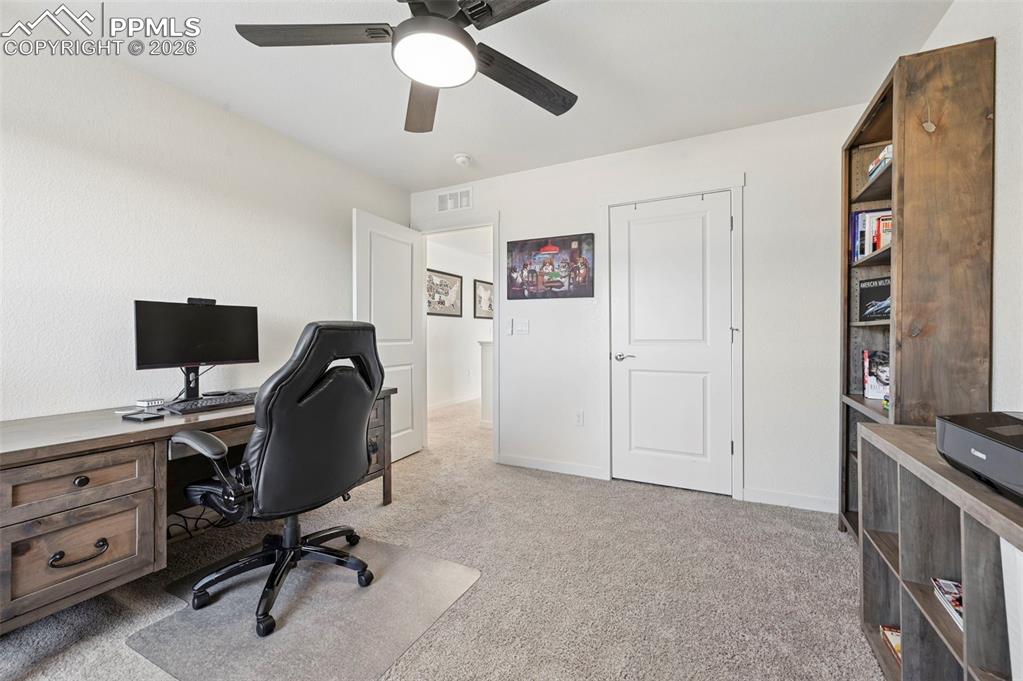 15945 Little Bluestem Road Monument, CO 80132 - Photo 28 of 49 a view of a workspace with furniture