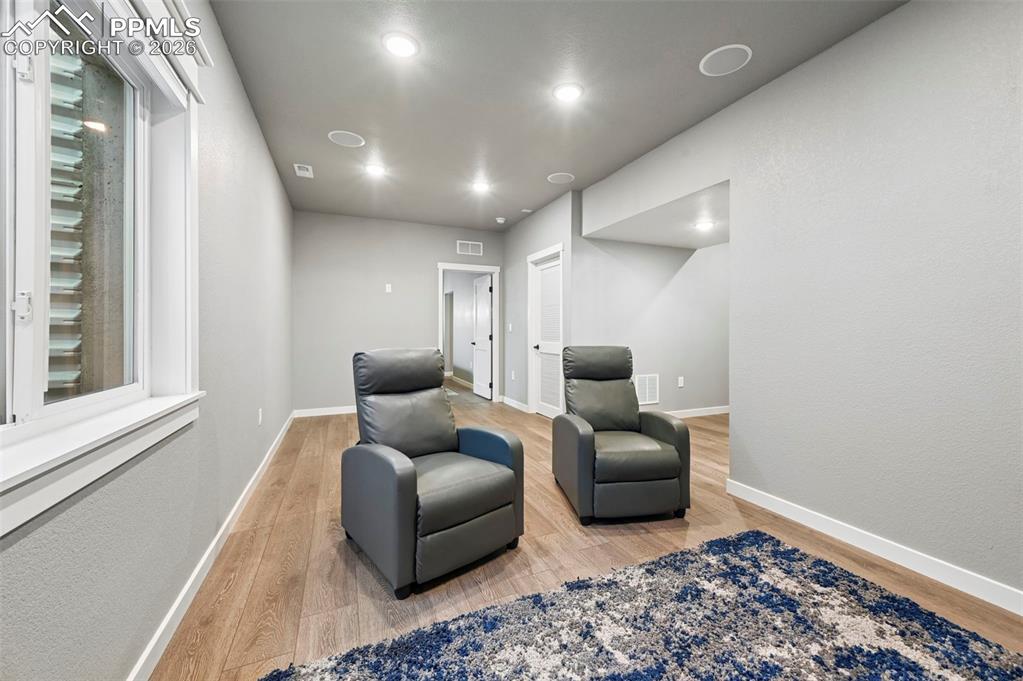 15945 Little Bluestem Road Monument, CO 80132 - Photo 31 of 49 a living room with furniture and a rug
