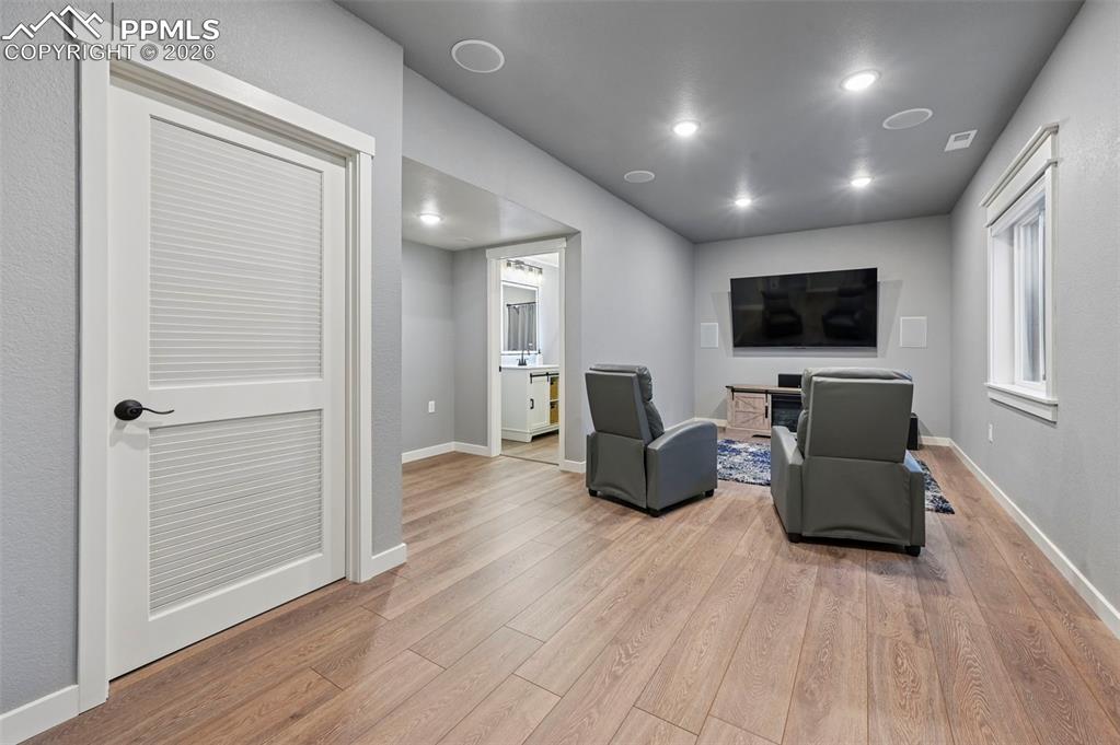 15945 Little Bluestem Road Monument, CO 80132 - Photo 32 of 49 a living room with furniture and a flat screen tv