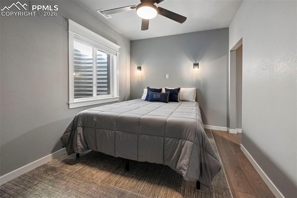 15945 Little Bluestem Road Monument, CO 80132 - Photo 33 of 49 a bedroom with a bed and a window