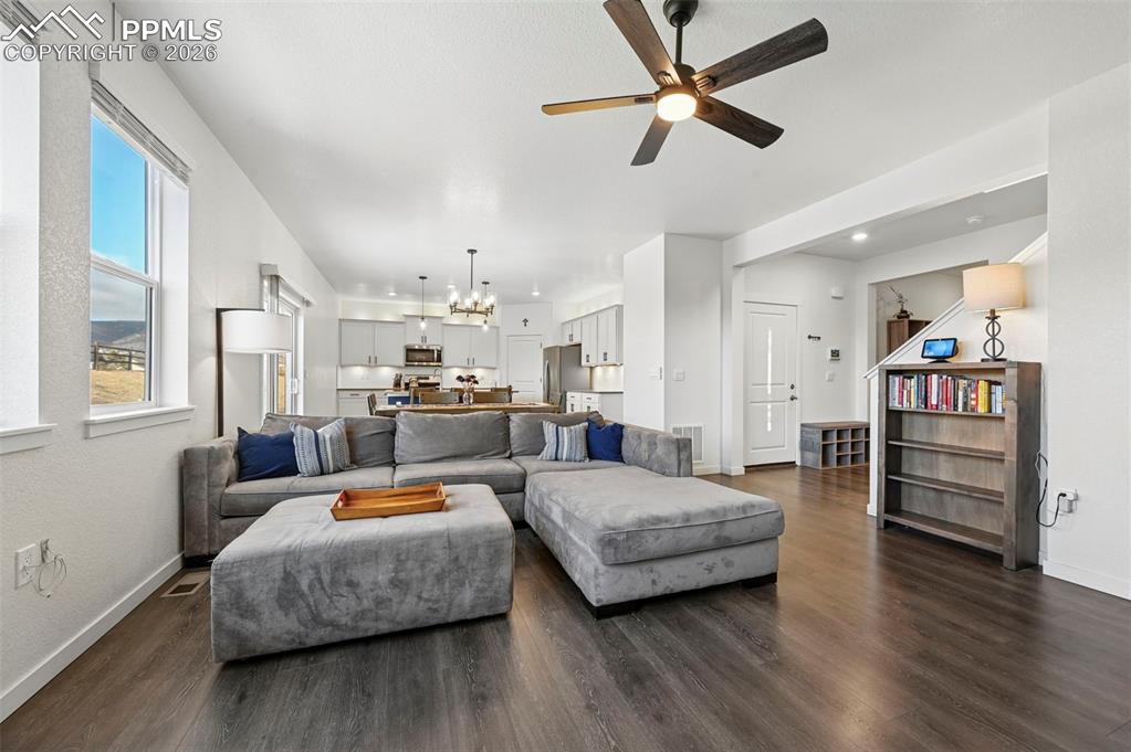 15945 Little Bluestem Road Monument, CO 80132 - Photo 4 of 49 a bedroom with furniture and a wooden floor