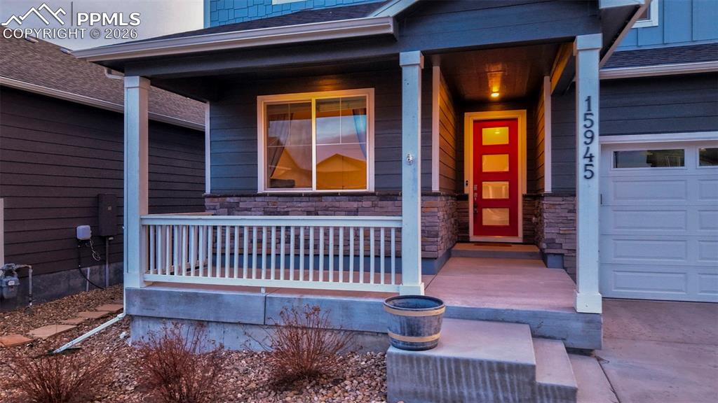15945 Little Bluestem Road Monument, CO 80132 - Photo 48 of 49 a view of front door of a house with a porch
