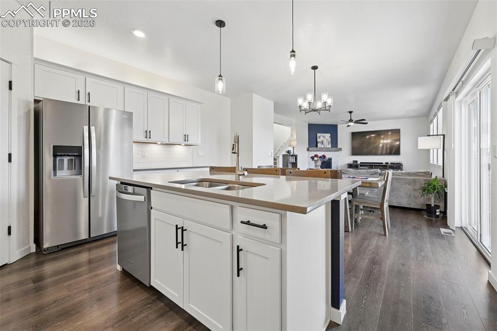15945 Little Bluestem Road Monument, CO 80132 - Photo 8 of 49 a kitchen that has a lot of counter space and stainless steel appliances