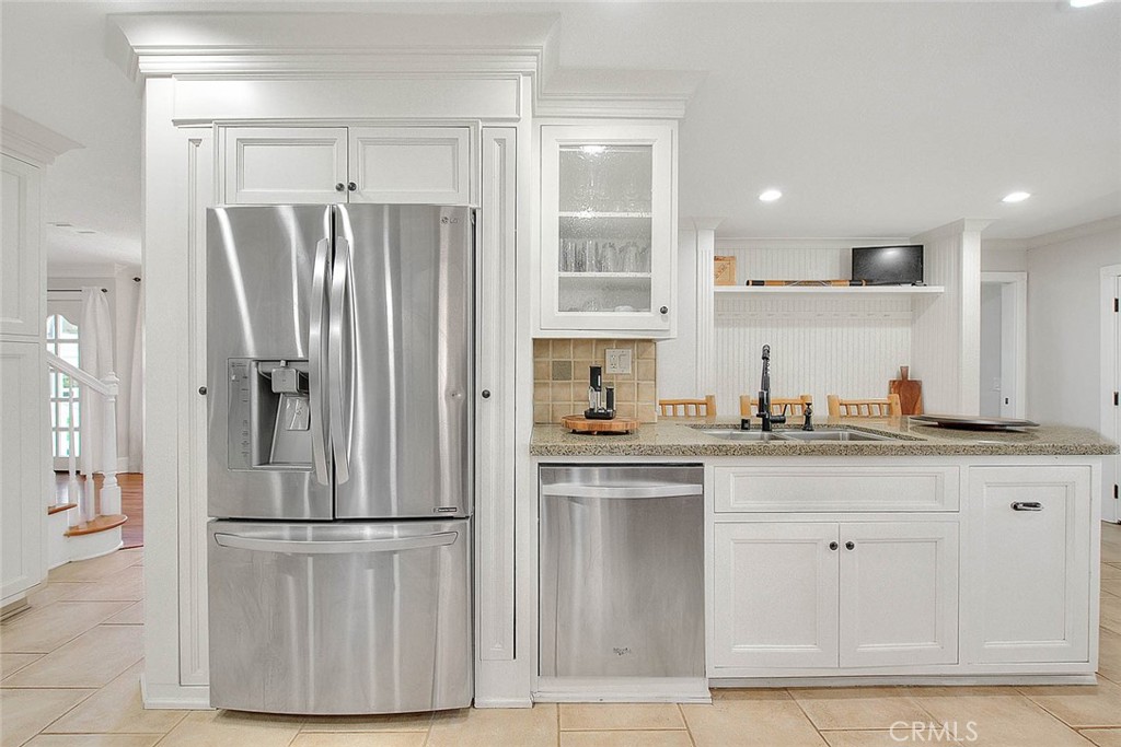 750 Jericho Drive Fallbrook, CA 92028 - Photo 22 of 74 a kitchen with white cabinets and refrigerator