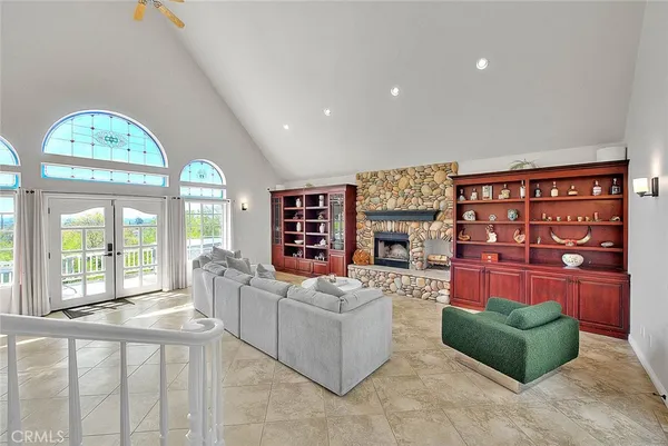 a room with furniture and pool table