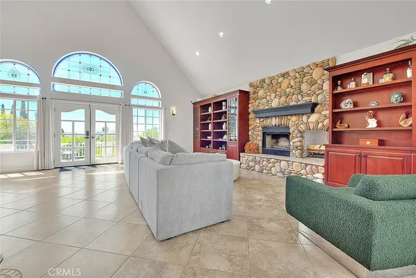 a room with furniture and a large window