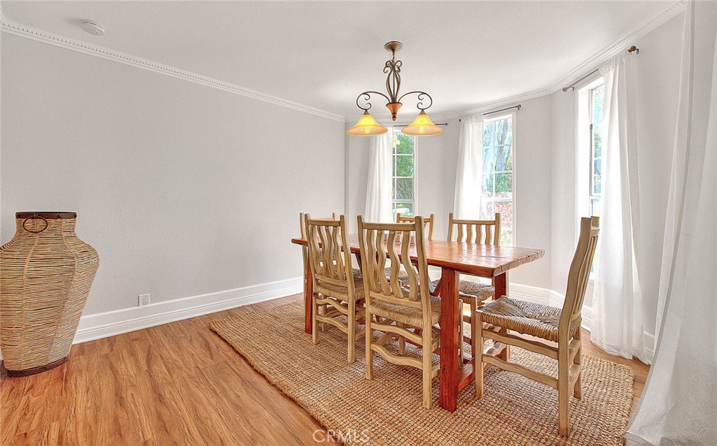 750 Jericho Drive Fallbrook, CA 92028 - Photo 39 of 74 a dining room with furniture a chandelier and wooden floor