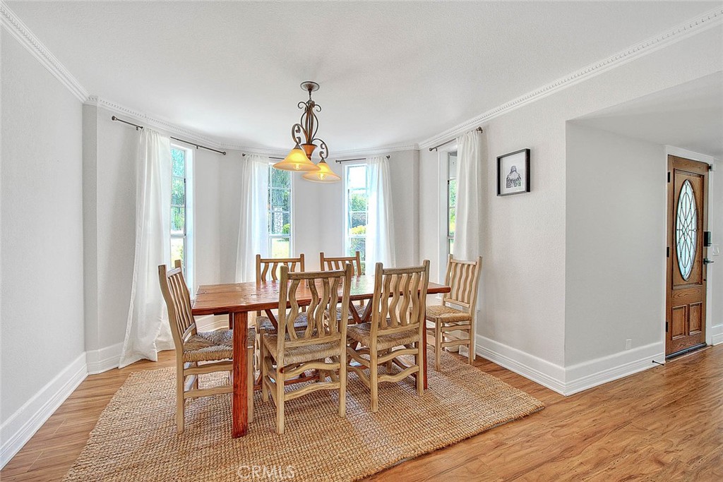 750 Jericho Drive Fallbrook, CA 92028 - Photo 40 of 74 a view of a dining room with furniture and wooden floor
