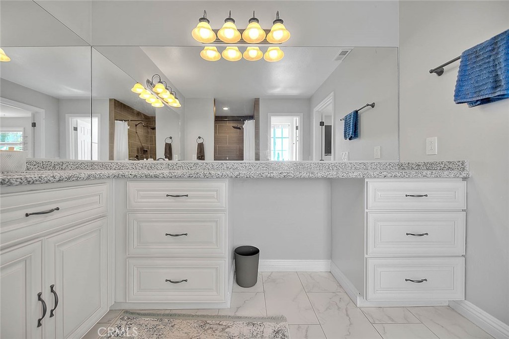 750 Jericho Drive Fallbrook, CA 92028 - Photo 49 of 74 a bathroom with a sink vanity and a mirror