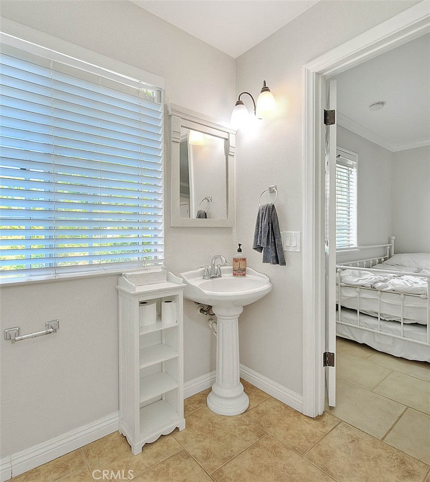 750 Jericho Drive Fallbrook, CA 92028 - Photo 52 of 74 a bathroom with a sink and a mirror