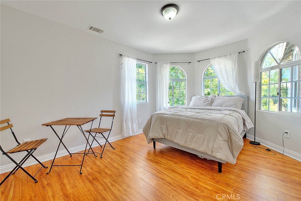750 Jericho Drive Fallbrook, CA 92028 - Photo 55 of 74 a spacious bedroom with a bed a chair and a large window