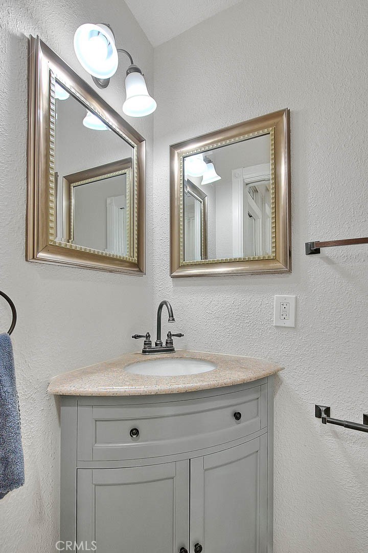 750 Jericho Drive Fallbrook, CA 92028 - Photo 58 of 74 a bathroom with a sink mirror and vanity