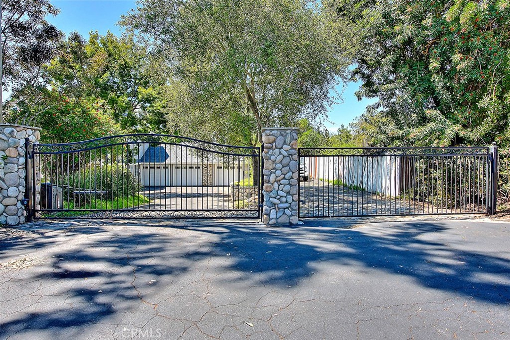 750 Jericho Drive Fallbrook, CA 92028 - Photo 7 of 74 a view of a backyard with large trees and wooden fence