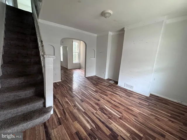 a view of bedroom with wooden floor