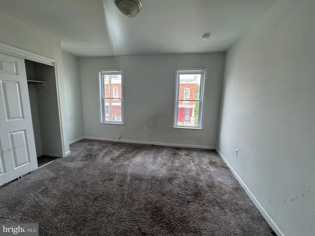 an empty room with windows