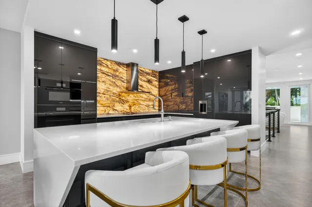 a bedroom with a bed and glass walk in closet